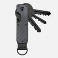 Carbon fiber key organizer with three keys fanned out