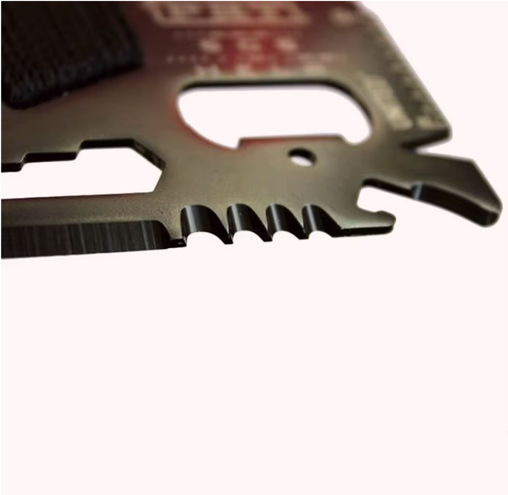 Close-up of the multitool's saw teeth and bottle-opener notch
