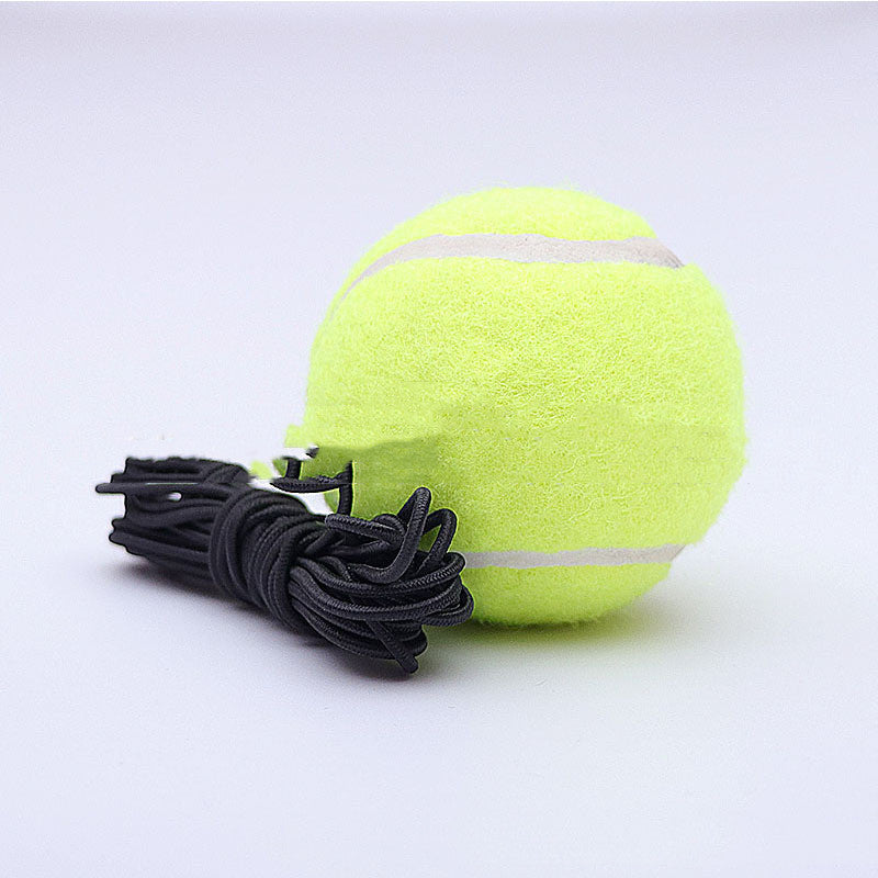 Yellow tennis ball with a black string on a light gray background