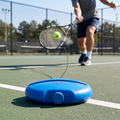 Player returning a ball tethered to the solo tennis trainer on court