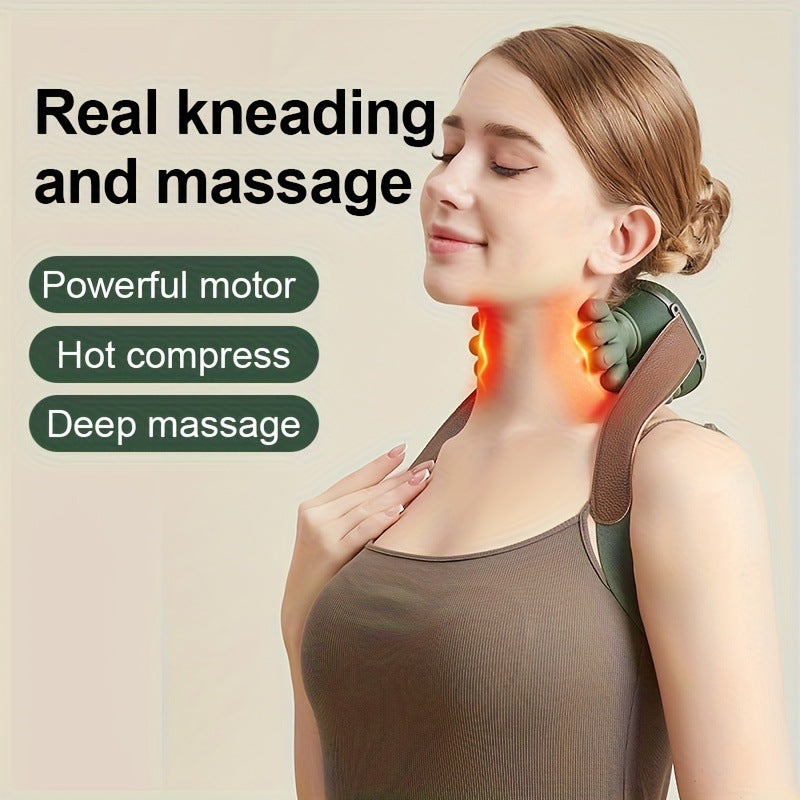 Neck massager worn on the shoulders while working at a laptop